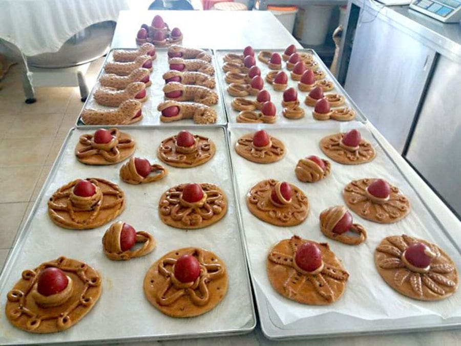small breads with Easter eggs on the top at The Apolloniatisses workshop